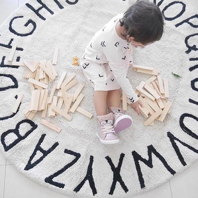 Tappeto rotondo per bambini con alfabeto